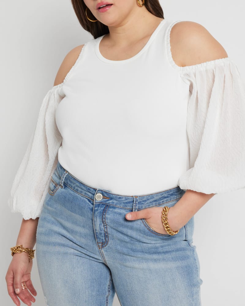 Front of a model wearing a size 14|16 Madison Cold Shoulder Top in Soft White by ELOQUII. | dia_product_style_image_id:215373